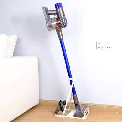 China Universal Stocked Metal Vacuum Cleaner Mop Holder With Beech Wood for sale