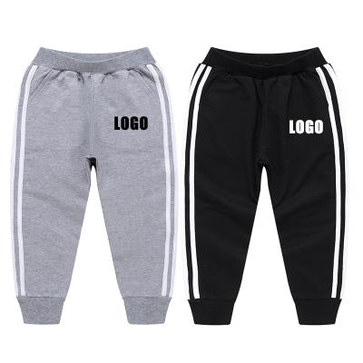 China 2021 Custom Logo Cotton Sports Children's Breathable Long Pants Wholesale Autumn Thin Solid Children Clothing for sale