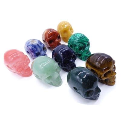 China Japan Wholesale Natural High Quality Crystal Skulls 2 Inch Rose Quartz Gemstone Head Carving Crystal Crafts for sale