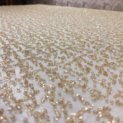 China Sustainable 130cm High Density Sequin Beaded Mesh Embroidered Lace Cloth High Fixed Wedding Dress Embroidered Bead Lace Fabric for sale