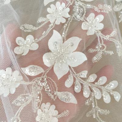 China Custom Made Luxury Beaded Bridal Lace Fabric Sequins Flowers And Leaves Embroidery Sequins Dress Fabric Silver High End Lace for sale