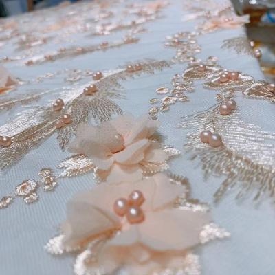 China Viable Exquisite Luxury Champagne Mesh Tulle Shiny Flowers For Sewing Beautiful Wedding Evening Dresses Sequin Embroidered Lace Fabric for sale