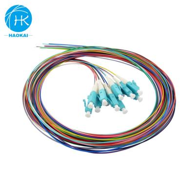 China FTTH FTTB FTTX Network 12 Core Waterproof SC APC Color 0.9Mm 12Core Fiber Optic Pigtail for sale