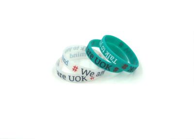 China Custom Logo Custom Silicone Bracelets , Silicone Band Bracelets With Colorful Words Infilled for sale