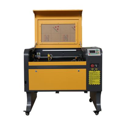 China Laser CUTTING cheap price CO2 pvc wood leather phone protector laser cutting machine 4060 for sale