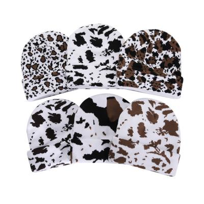 China Bucket hats wholesale cute hats students hot leopard print cow knit hats wool hats for sale