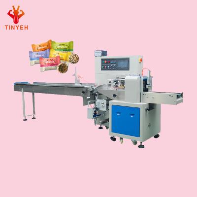 China High efficiency high speed energy ball chocolate ball pillow bag packaging machine automatic feeding candy ball snack machine price for sale