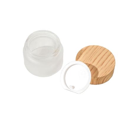 China Low MOQ 5g10g15g 20g30g50g100g Cosmetic Cream Bottle Frosted Glass Jar Skin Care Cosmetic Packaging With Wood Grain Lid for sale