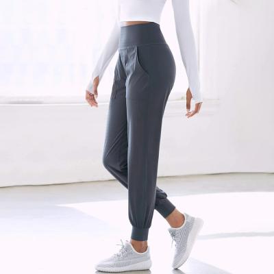 China Promotion Breathable Women's Slim Solid Color Sports Pants High Quality Women Pocket Track Pants for sale