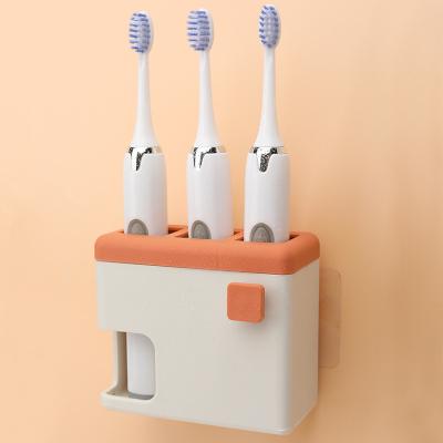 China Viable Simple Wall Hanging PP Material Bathroom Electric Toothbrush Punchless Toothbrush Holder for sale