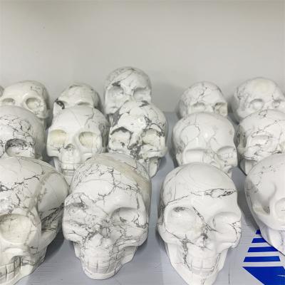 China China Wholesale Hand Carved Howlite Crystal Skulls Natural Gemstone For Hollow Crystal Crafts for sale