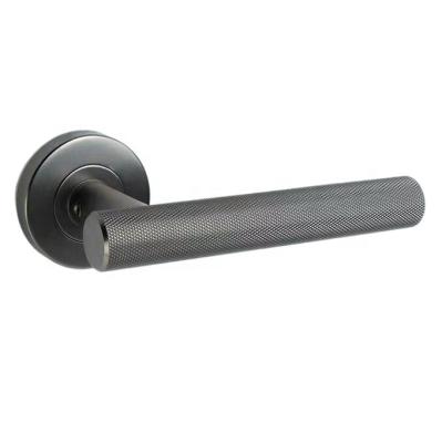 China Modern Round Knurled Interior Door Handle Solid Stainless Steel Skyscraper Lever for sale