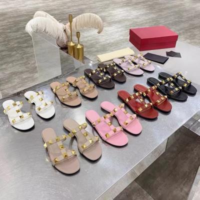 China Fashion Trend 2022 New Summer Lazy Flat Slippers Rivet One Word Casual Flip Flops Roman Sandals For Women Outdoors for sale