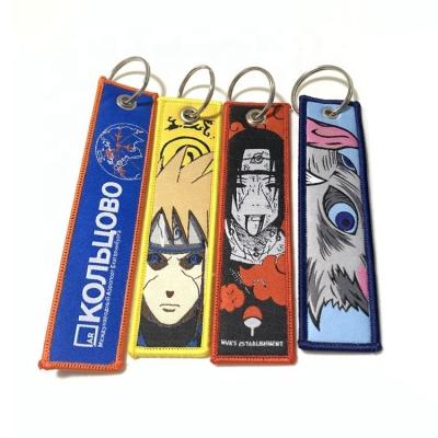 China Promotion Gift Take Off The Flight Cloth Woven Embroidery Keychains Anime Jet Tag Keytag Key Chain Custom Logo for sale