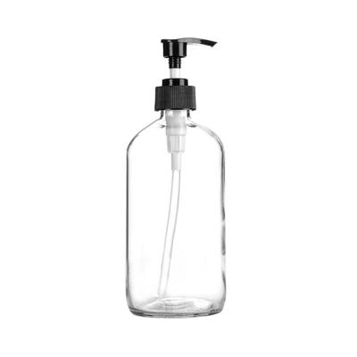 China 16Ounce Clear Boston Glass Cosmetic Round Bottle With Plastic Lotion Pump Dispenser for sale