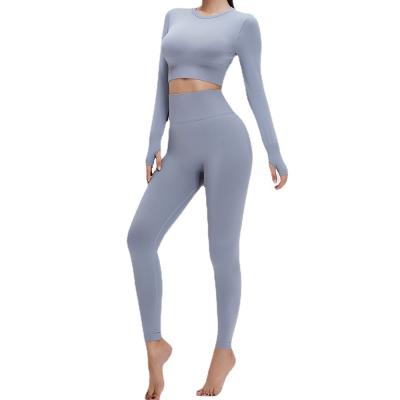 China Solid Color Breathable Wholesale Tight Fitting Yoga Set Two Piece Fitness Clothing Suit for sale