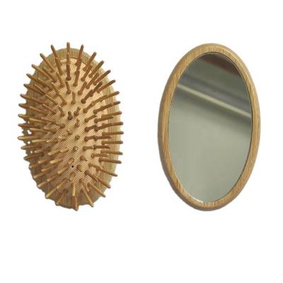 China New Arrival Waterproof Mini Pocket Cushion Hair Comb Oval Wooden Bamboo With Mirror On The Back for sale