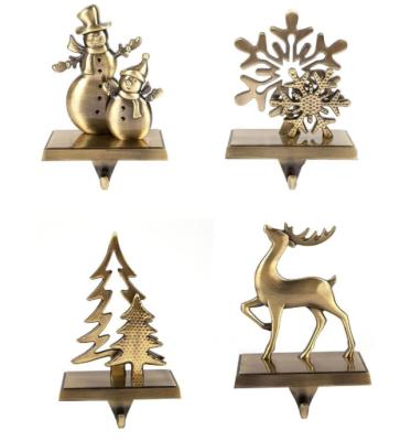 China Decorative Eco-friendly Christmas Metal Mantel Stocking Holder for sale