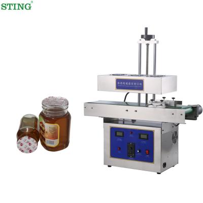 China Automatic Electromagnetic Induction Food Sealing Machine Food Tin Foil Oil Bottle Honey Bottle Aluminum Foil Plastic Packaging Machine for sale