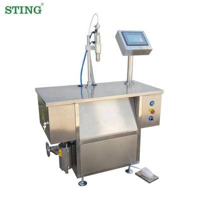 China Food Mini Semi Automatic Brake Neem Ohlins Silicone Edible Oil Glass Bottle Filling Machine for sale