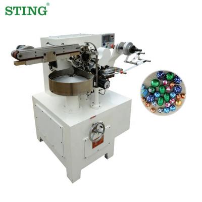 China Small Food Wrapping Mini Aluminum Foil Chocolate Wrapping Packaging Machine For Chocolate Eggs for sale