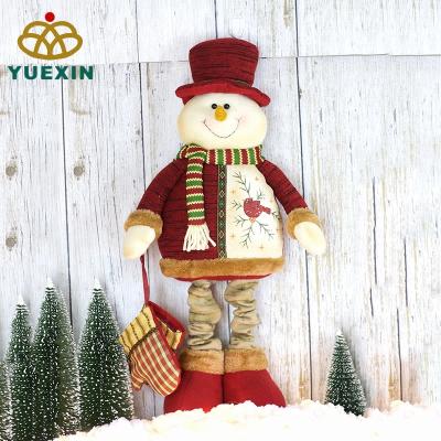 China Gift & Decoration Plush Christmas Snowman Doll Telescopic Wear Red Hat for sale