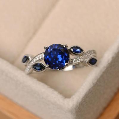 China CAOSHI Newest Design Romantic Ring Blue Crystal Leaves Rings for Women Silver Flat Fashion Round Stone Rings for sale