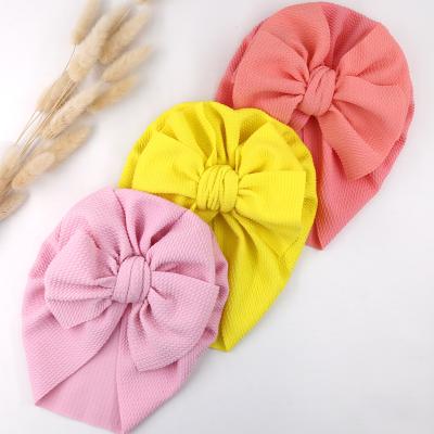 China Skin Friendly Waffled Hat Bebe Cap Beanie Top Bow Newborn Infant Cloth Baby Turban Knot Photography Props Hood Soft Textured Headwrapss for sale