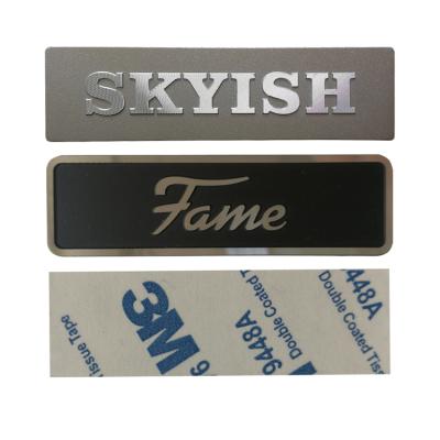 China Waterproof custom embossed silver metal labels aluminum nameplates with rivet stamping 3d letters metal logos sticker alphabet signs for sale