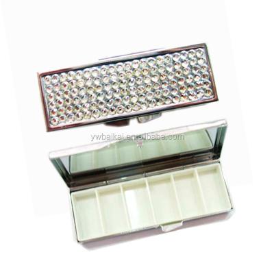 China 6days metal pill box with bling faux stone 8*4.5*1.5cm for sale