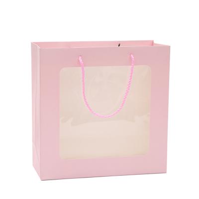 China Recycled Materials Customized Open Transparent Window Paper Bag Wedding Gift Paper Gag Carry Packaging With Handle for sale