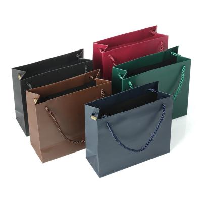 China Recyclable Customized Small Paper Bag Packaging Handle Kraft Paper Bag for sale