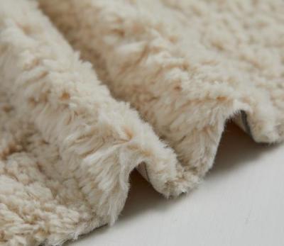 China Big Pattern Wholesale Auto Color Beige Color Faux Curly Upholstery Fur Fabrics for sale