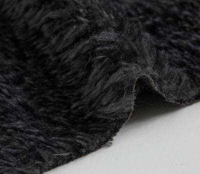 China Auto Upholstery Pure Black Color Long Pile Faux Fur Curly High Fabrics for sale