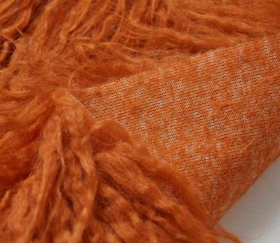 China Auto Pile Wonderful Orange Long Light Curly Upholstery Polyester Knitted Faux Fur Fabrics for sale