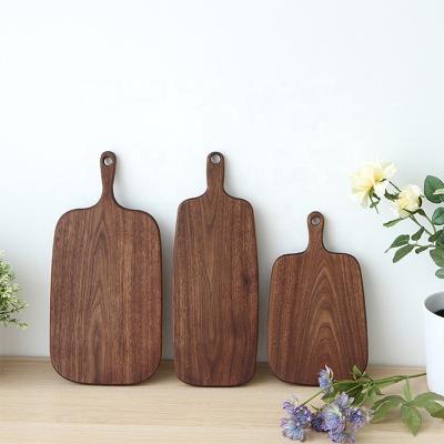 China Sustainable New Design Kitchen Accessories Beech Black Walnut Ebony Wooden Serving Tray Cutting Board for sale