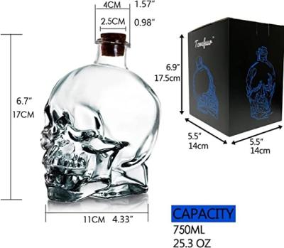 China Custom Color 750 ml Lead-free Skull Glass Bottle with Cork Stopper Lead-free Material for sale