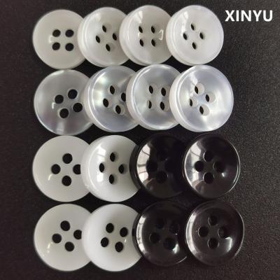 China Resin pearl button button sales white bottom viable bowl 2/4 hole plastic transparent black and white shirt button for sale