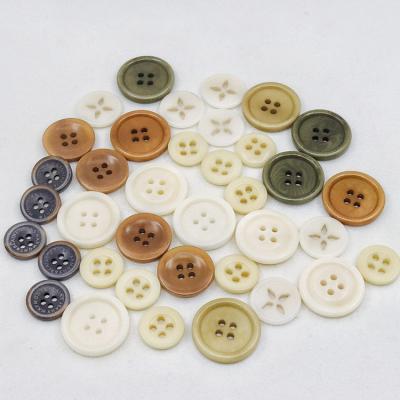 China Wholesale custom color viable freewashable nickel color laser engraved white natural pattern 4 hole corozo buttons for sale