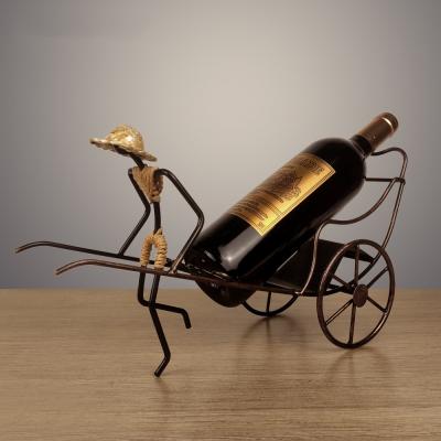 China Antique Minimalist Wine Rack Table Rickshaw Metal Iron Wine Rack For Home Decoration Chinese Style Gift for sale