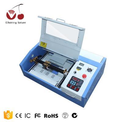 China 60W laser engraving 3020 grabador laser engraving machine used for cutting bamboo, wooden products, glass, fur, bathroom, PVC material for sale