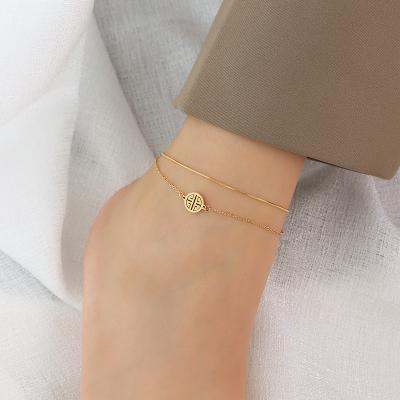 China Hot Sales FASHIONABLE Fashion Stainless Steel Anklet Chains Blessed Snake Chain Double Layer Gold Plated Anklet Chains With Chinese Blessing Charm for sale