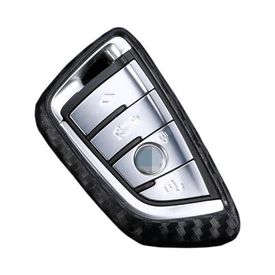 China Non-Toxic Carbon Fiber Pattern Silicone Car Key Case Cover For BMW X5 X6 X4 X3 1 2 Series Remote Key Holder for sale