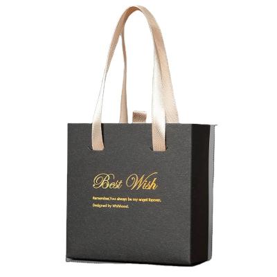 China 2023 Custom Logo Cardboard Packaging Black Luxury Cosmetic Shopping Gift Recyclable Jewelry Paper Bag With Handle for sale