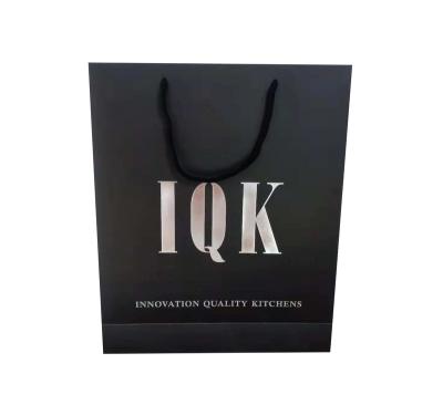 China Recyclable OEM Clothes Pants Packaging Shopping Paper Bag With Own Design Logo Silver Hot Foil Luxury Wholesale Custom Paper With Handles for sale