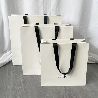 China Recyclable Customized Logo Printed Luxury Paper Bag Small Jewelry Gift Boutique Custom Shopping Packaging With Bow Ribbon Handle for sale