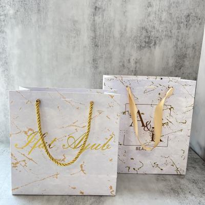 China Hot Customized Recyclable Marbling Foiled Logo Design Paper Bag Fancy Luxury Gold Foiled Logo Wedding Gift Thank You Paper Bag With Handles for sale