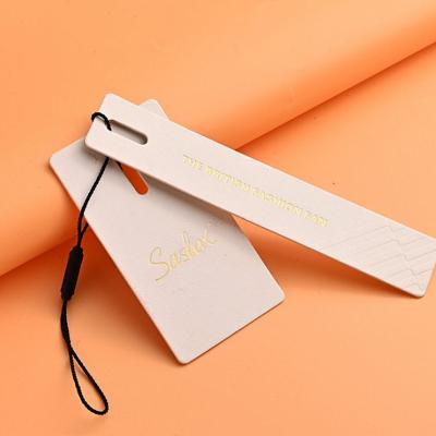 China Garment Hang Tags Popular String Hang Recyclable Luxury Thick Hot Stamping Paper Tag for sale