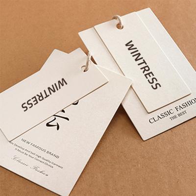 China Recyclable Wholesale Clothing Hang Tags Customized Paper Logo Tag Free Design Hang Tags For Garment for sale