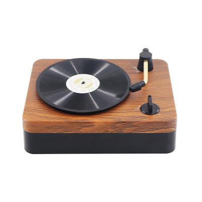 China Wireless Charger for Mini Portable Creative Black Rubber Retro Speaker Mobile Phone Selling Cultural Wooden Speakers Small Sound Source Hot Record Table for sale